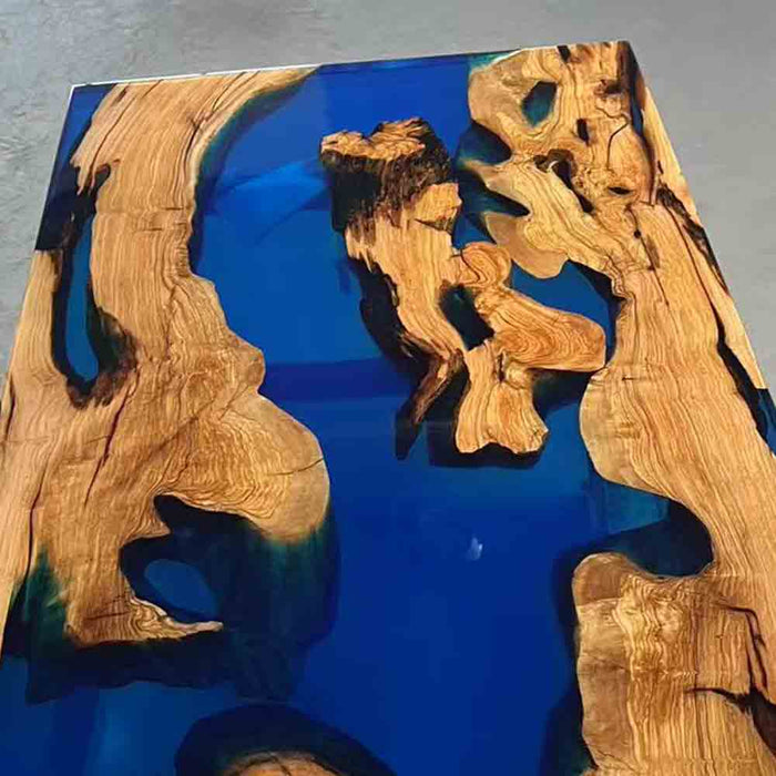 Wooden surface with blue resin inlay on a gray background