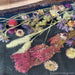 Epoxy river walnut dining table with botanical details commonly styled in Texas homes.