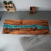 Custom river epoxy dinning table showcasing rich walnut wood grain