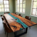 Walnut river epoxy dinning table styled in a modern dining room
