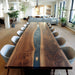 Close up of navy blue epoxy resin and black walnut wood grain