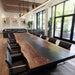 Modern executive conference table made from black walnut and black epoxy