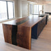 Handcrafted black walnut table with black resin river in living room