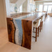 Artisan black walnut ocean epoxy table styled in luxury interior decor