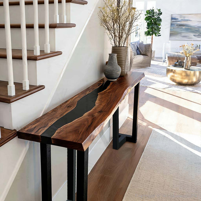 Black resin and walnut epoxy console table in a stylish foyer setting