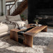 Handcrafted black resin epoxy coffee table next to modern sofa