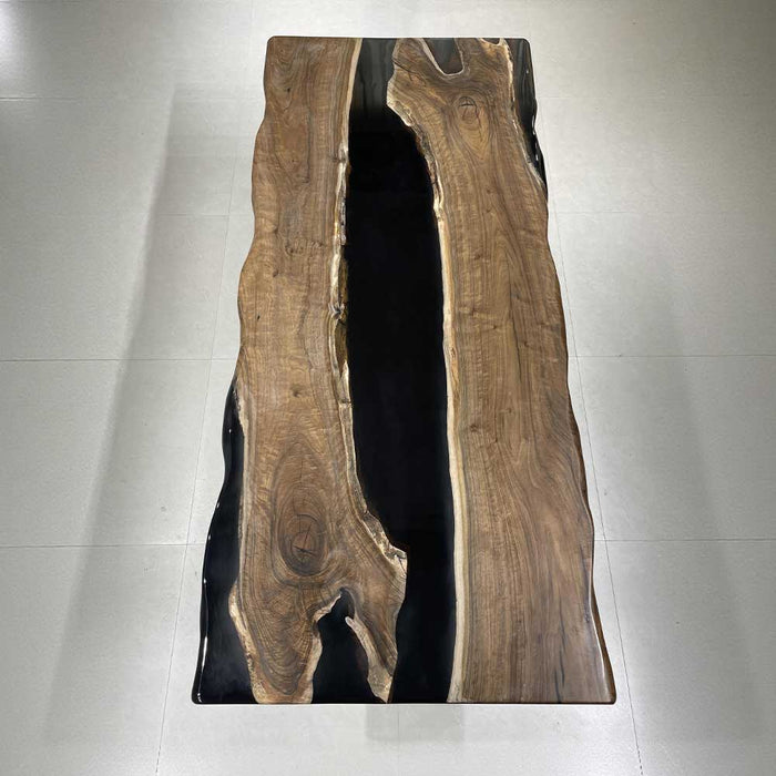 Custom handmade live edge walnut conference table with black epoxy resin center.