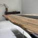 Luxury black walnut river conference table for modern boardroom spaces.