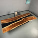 Modern walnut conference table with two integrated power outlets for meeting rooms