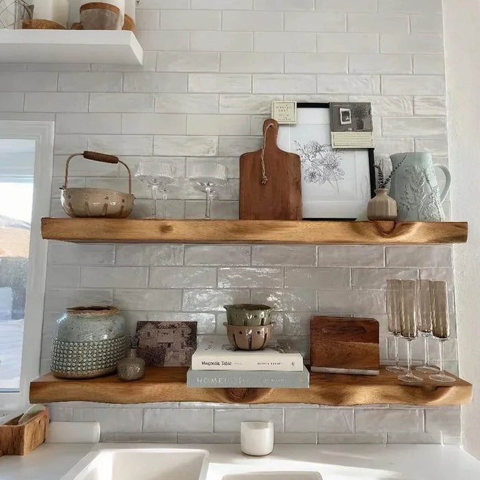 Wooden shelves with decorative items against a tiled wall