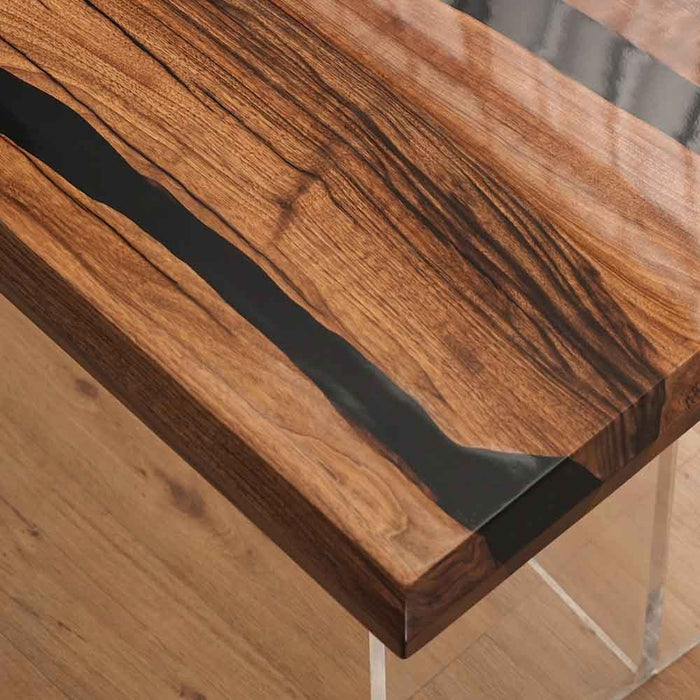 Wooden table with a black resin inlay