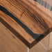 Wooden table with a black resin inlay