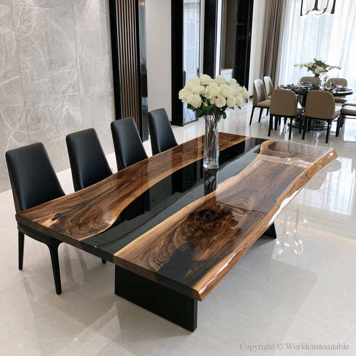 Modern black walnut river table placed in a luxury dining space, highlighting the contrast between natural wood and glossy black epoxy resin.