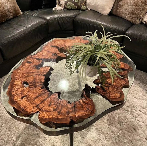 Coffee table featuring live edge wood and clear epoxy resin.