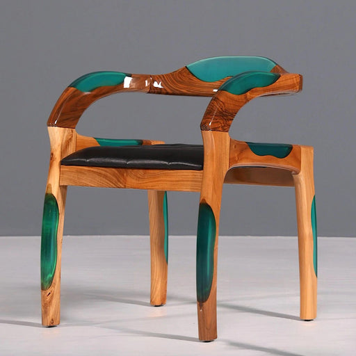Wooden chair with green accents on a gray background
