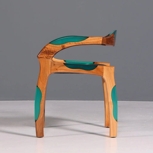 Wooden chair with green accents on a gray background