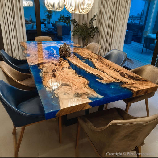 Epoxy dinning table featuring blue resin and olive wood grain