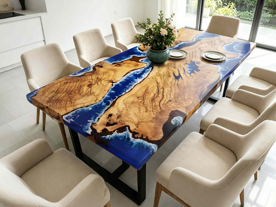 Handcrafted golden camphor table with artistic ocean resin detailing and natural wood grain.