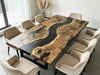 Artisan-crafted walnut epoxy table featuring a flowing black river design, made in the USA.