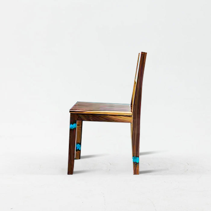 Wooden chair with turquoise accents on a white background