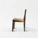 Wooden chair with turquoise accents on a white background