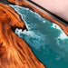 Wooden table with a resin-embedded ocean design
