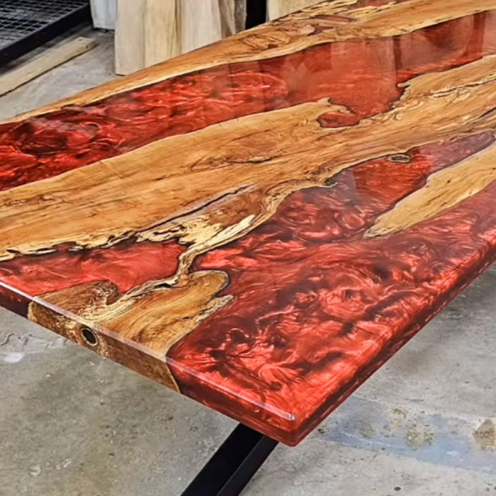 Artistic wood and resin table designed for upscale modern interiors