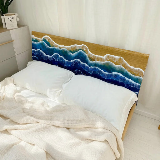 Custom ash wood headboard with deep blue ocean epoxy design