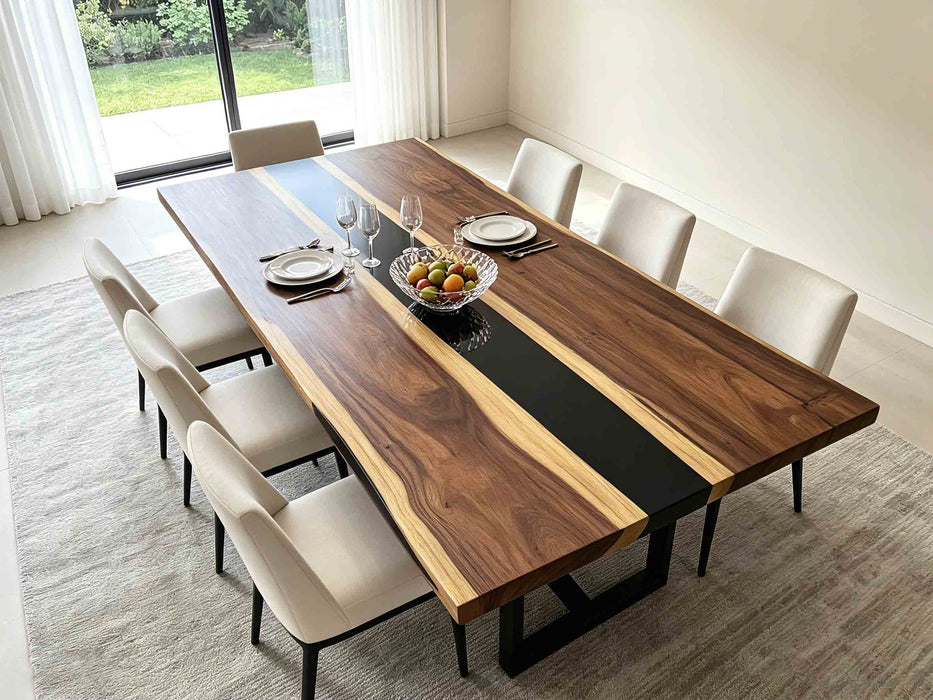 Bespoke walnut dining table with resin detail in a bright California interior.