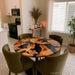 Black burl wood epoxy dining table with round live edge design and dark resin finish