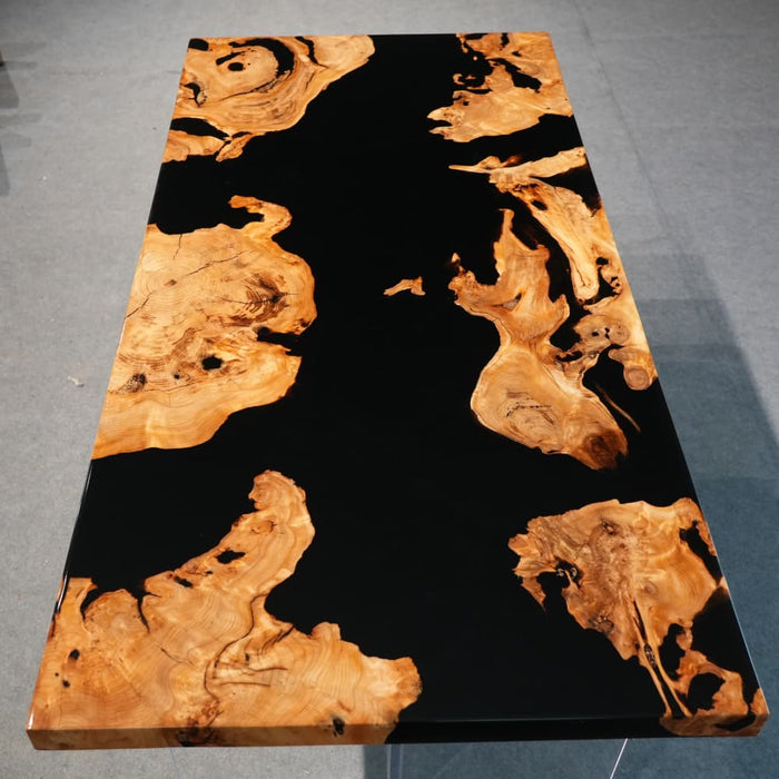 Black epoxy olive wood dining room table with natural grain