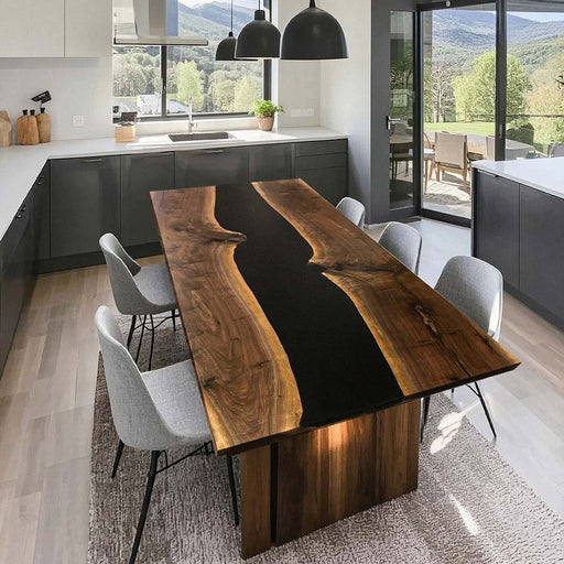 Black epoxy river dining table in a modern kitchen with mountain view.