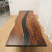 Black epoxy wood conference table with natural walnut grain