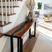 Black resin and walnut epoxy console table in a stylish foyer setting