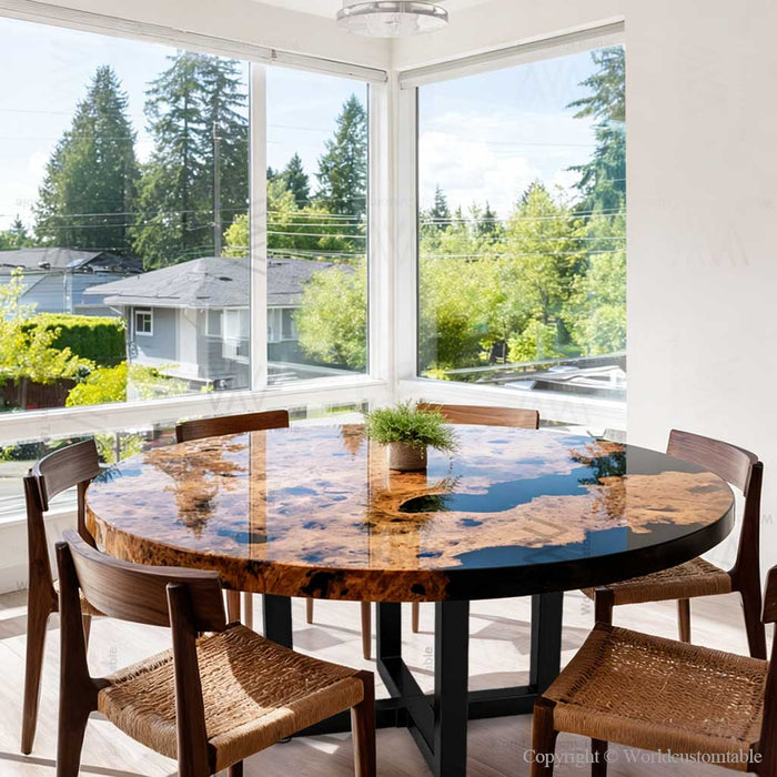 Round epoxy dinning table with bold black resin contrast