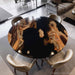 Black resin round coffee table highlighting olive wood grain