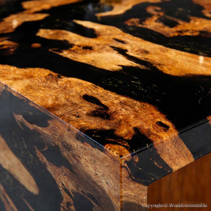 Black resin epoxy waterfall table in a modern dining room setting