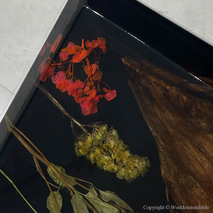 Black walnut live edge table with black epoxy resin and embedded floral design, handcrafted statement dining table