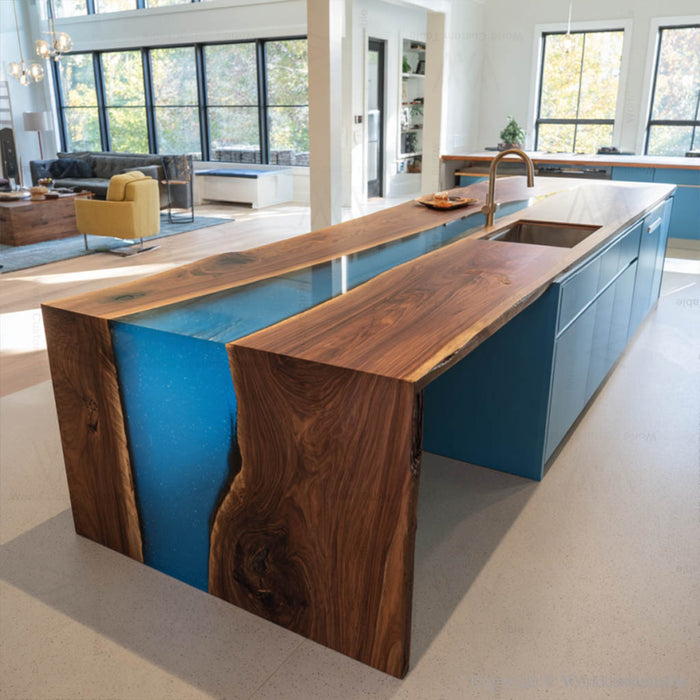 Black walnut blue epoxy waterfall table in a dining room setting