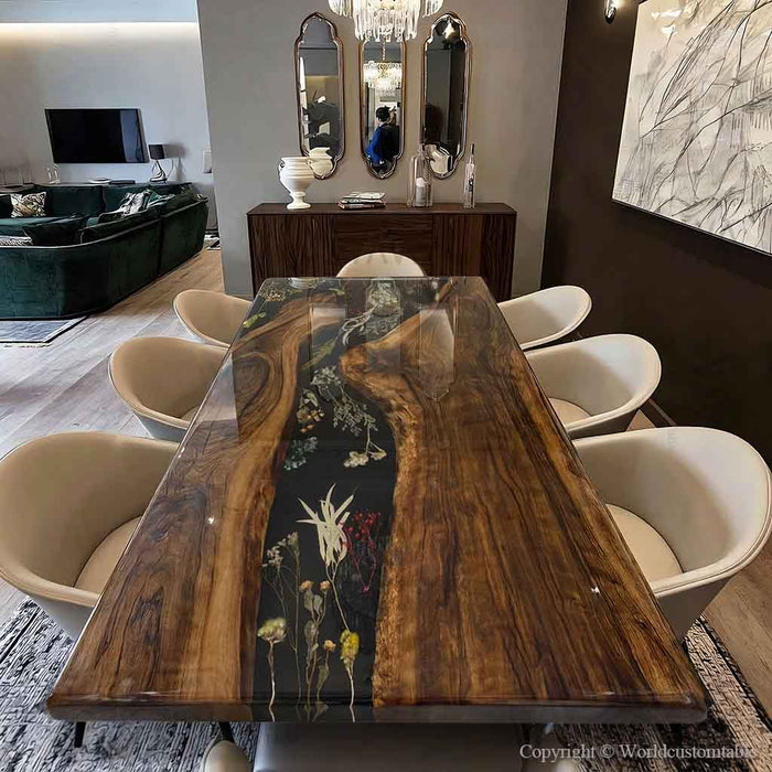 Black walnut epoxy dining table with floral resin flowing through the center in a luxury dining room setting