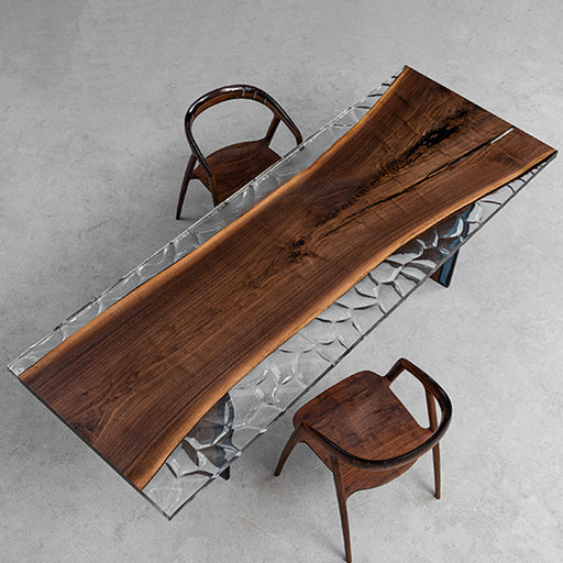 Black walnut dining table with crystal clear ice epoxy resin on both sides, modern river table design.