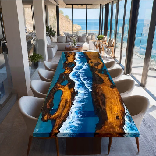 Dining table with ocean-themed design in a modern living room with large windows overlooking the sea.