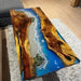 Wooden table with blue resin inlay on a gray rug