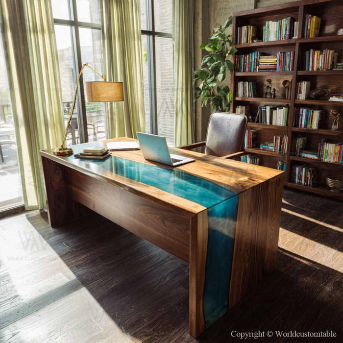 Black walnut epoxy waterfall table with teal resin in a study room