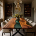 Dining room with a wooden table and chairs, featuring a vase of flowers.