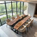 Live edge black walnut dining table with black resin center in a modern California interior.