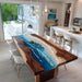 Dining room with a unique wooden table featuring an ocean design.
