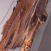 Wooden driftwood pieces on a light gray surface