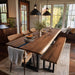 Black walnut dining table set featuring a translucent black epoxy river and matching live-edge bench.