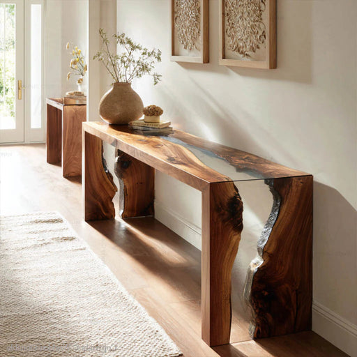 Wooden console table with natural finish in a room with light-colored walls and a rug.